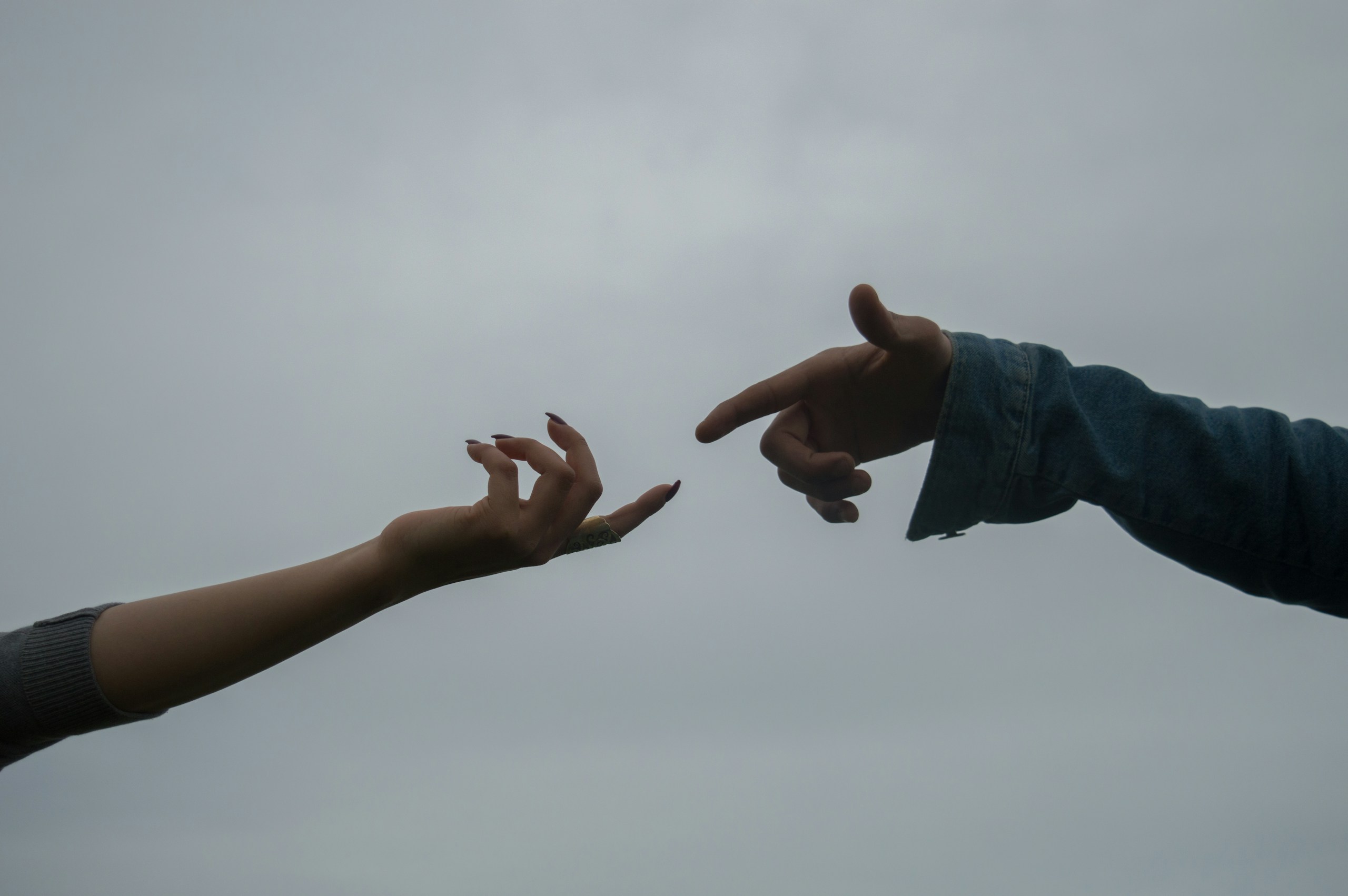 a-pair-of-hands-reaching-out-to-each-other-stockpack-unsplash